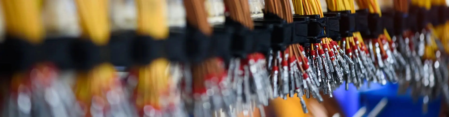 Bundle of crimped cables with electrical connectors. Terminated wire ready for connection.